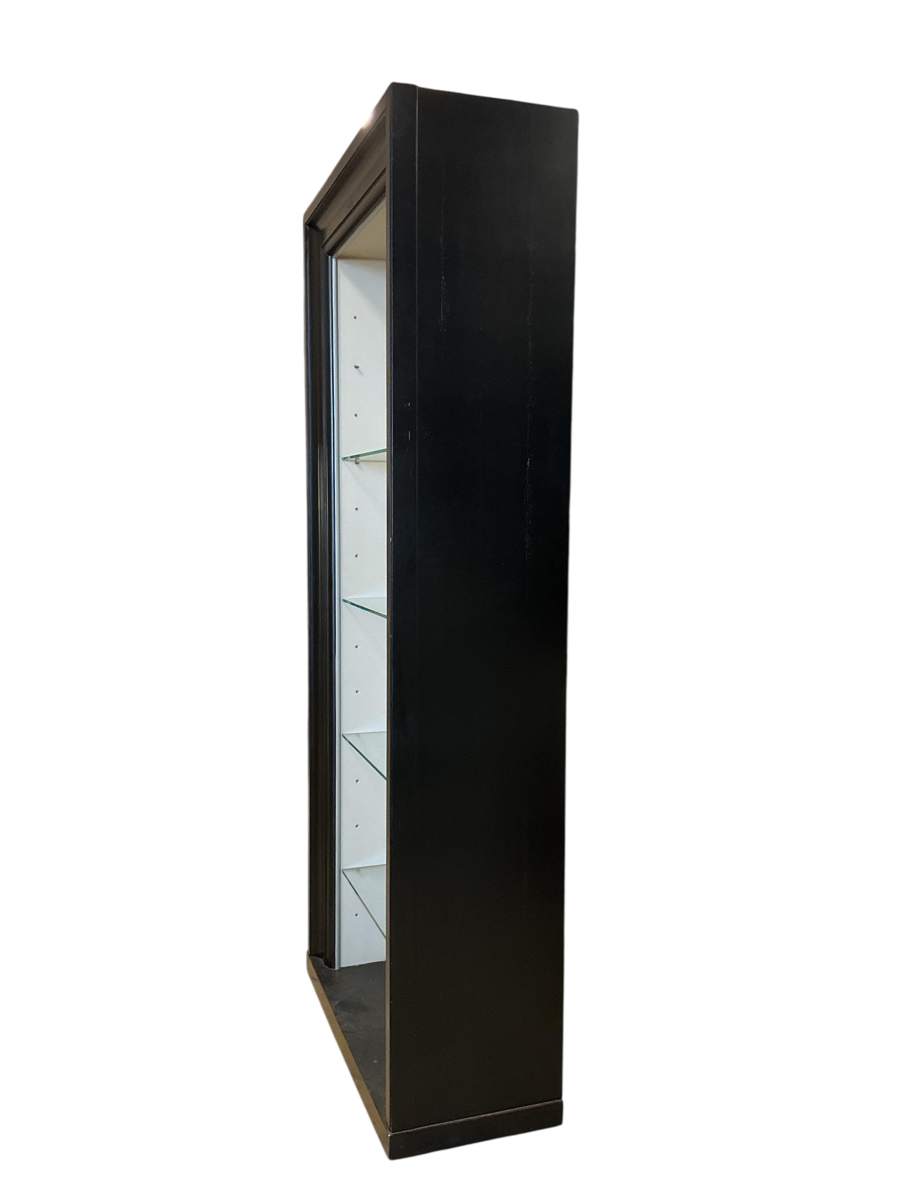 A pair of contemporary ebonised open display units, width 92cm, depth 39cm, height 217cm